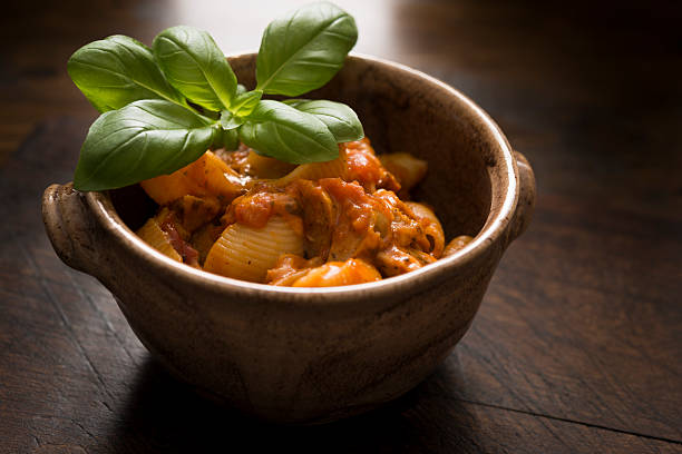 Shell Pasta with a meatball sauce topped with fresh Basil.
