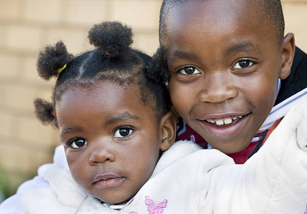 istock African Boy with Baby Sister 166085178