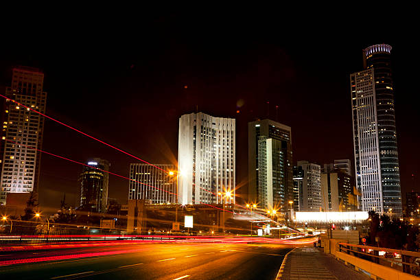 Colorful trails of light is all that remains from the swift highway traffic, rushing towards the downtown district of Ramat-Gan (Israel); where the famous Israel diamond trade center is located.