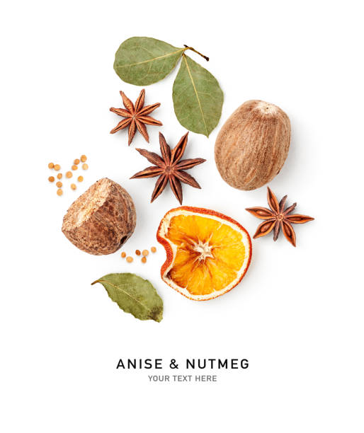Anise, nutmeg, bay leaf and orange isolated on white background