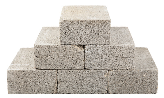 Six gray concrete construction blocks (a.k.a. cinder block, breeze block, cement block, foundation block, besser block; professional term
