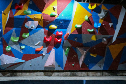 Climbing wall in the gym. Abstract background and texture.