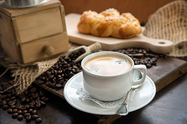 istock Coffee cup in front of an old coffee grinder 166091047