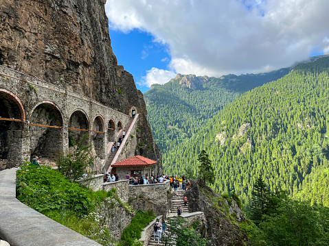 Entrance of Sumela Monastery. Tourists visiting Soumela Monastery. Trabzon, Turkey - June 24, 2023.