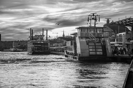 Hamburg, Germany September 04.2023: Black and white shot of the port of Hamburg near the Landungsbrücken