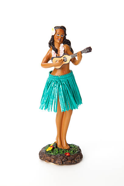istock A hula doll in a grass skirt with a ukulele 166091883