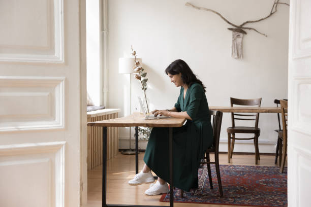 istock Focused young woman freelancer work on-line using laptop 1660933375