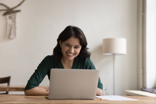 istock Happy Armenian female freelance doing telework using laptop 1660935748