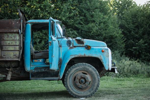 istock Vintage weathered old blue truck on a grassy field 1660964607