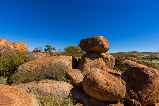 The Devil's Marbles are unusual rock formations in Australia's Outback. They're important to Aboriginal culture and look great in photos. People visit for their unique shapes and to experience the desert environment.