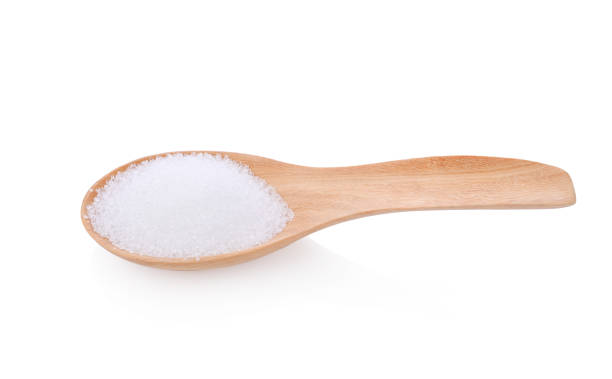 istock White sugar in wooden spoon on white background 1661018817