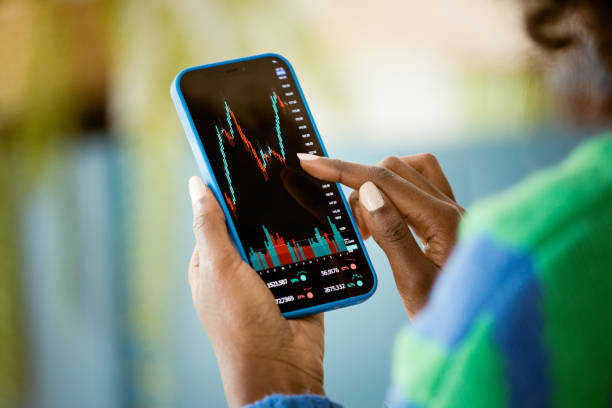 istock Woman watching stock charts 1661021876