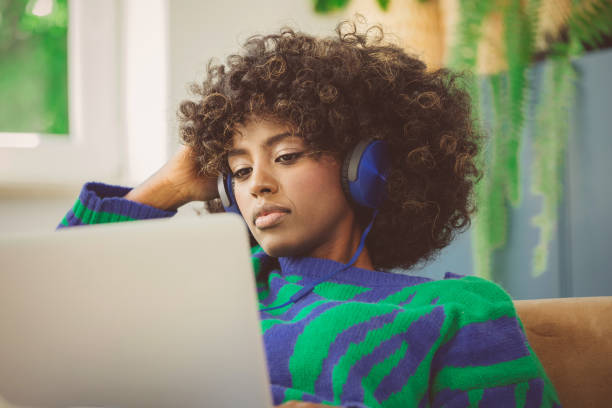 Young woman using laptop at home