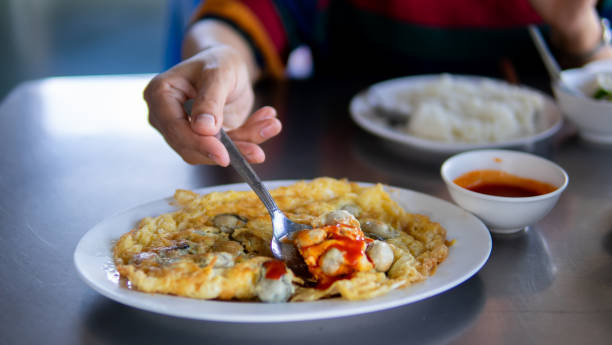 istock Close up women eating seafood 1661022044