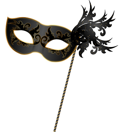 Close-up of black and gold masquerade mask
