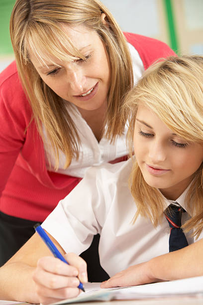 istock Female Teenage Student Studying In Classroom 166103992
