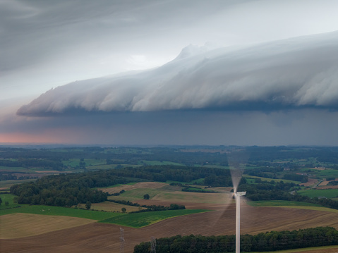 This aerial drone photo shows the france landscape with a very strange squall cloud which shows a heavy storm.