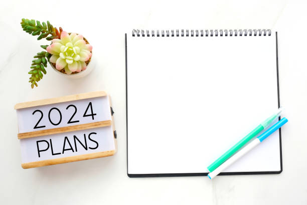 istock 2019 on wood box, blank notebook paper on white marble table background, 2019 new year mock up, template with copy space for text, top view 1661060508