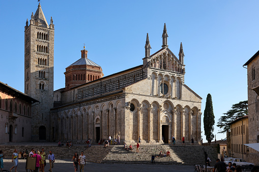 Massa Marittima, Italy - Sept 11, 2022: View at the Cathedral of Saint Cerbonius with Bell tower at the Garibaldi place in Massa Marittima. Italy