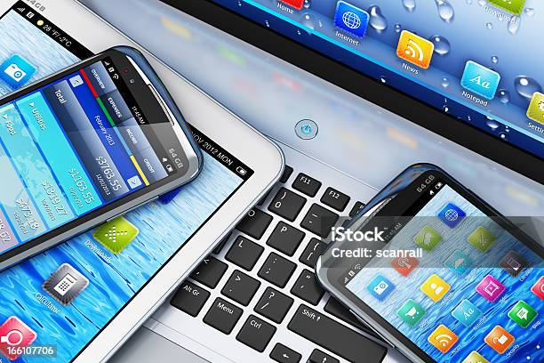 Mobility Concept With Digital Devices On Laptop Stock Photo - Download Image Now - Equipment, Electronics Industry, Technology