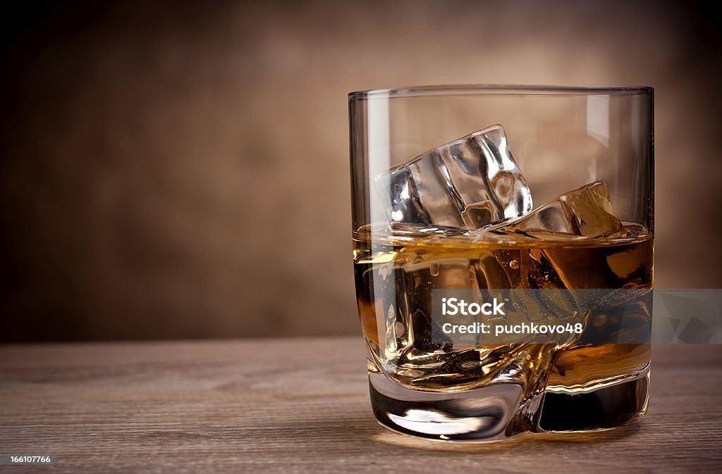 one glass of whisky one glass of whisky on a wooden table Alcohol - Drink Stock Photo