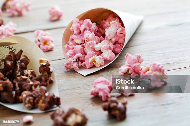 Strawberry Chocolate Popcorn Spilling Onto Wooden Surface Stock Photo - Download Image Now