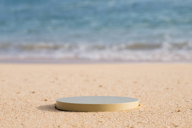 istock Beige platform on the beach for standing product against the ocean background 1661086420