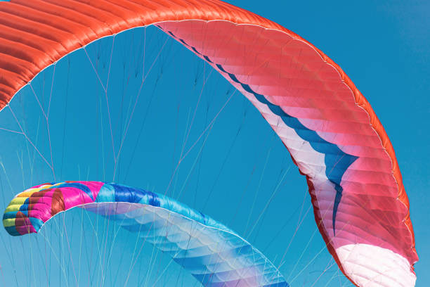 istock Colorful paraglider close-up against the blue sky 1661088015
