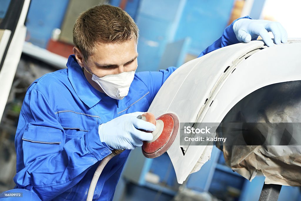 auto mechanic polishing car auto mechanic worker polishing bumper car at automobile repair and renew service station shop by power buffer machine Sand Paper Stock Photo