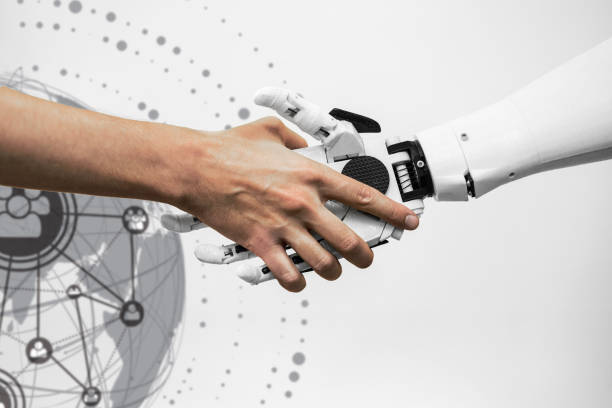 istock man shaking hands with a robot on a white background close-up of a handshake 1661098345