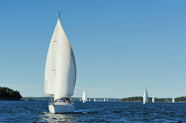 Sailboat approaching stock photo