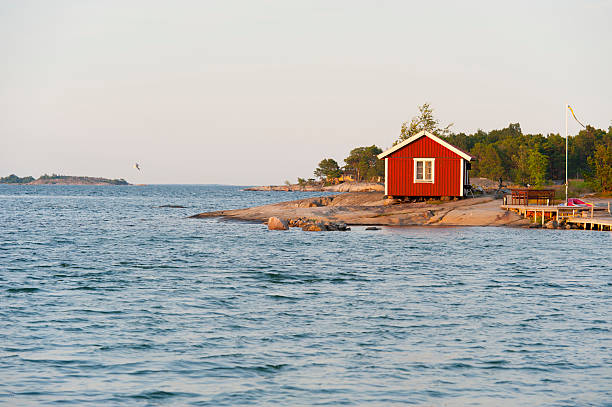 Sunset on a cute little cottage in the archipelago stock photo