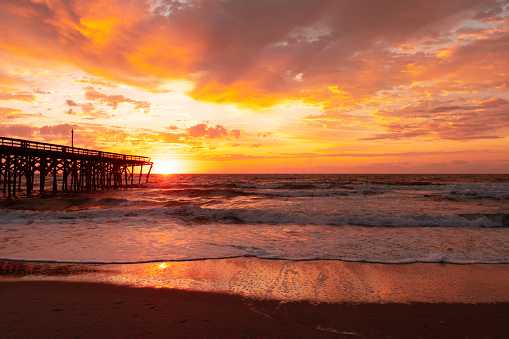 Pawley's Island, South Carolina, USA - Sunrise at the Pawley's Island fishing pier showing the damage from Hurricane Ian where half of the pier was blown out to sea.