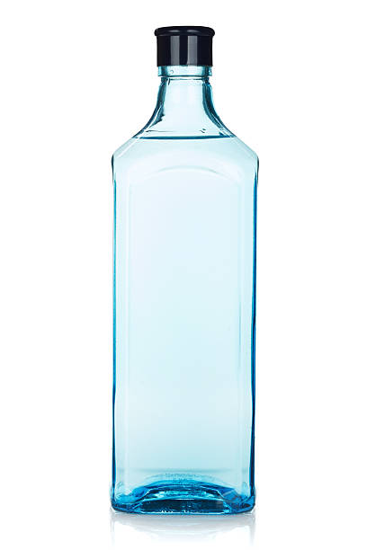 Glass gin bottle Glass gin bottle. Isolated on white background gin stock pictures, royalty-free photos & images