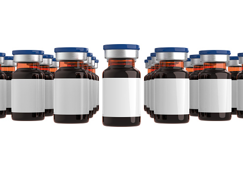 Medicine bottles for injection. Medical brown glass vials with blue caps, liquid solution for infusion isolated on a white background. Blank label mockup. 3d rendering illustration
