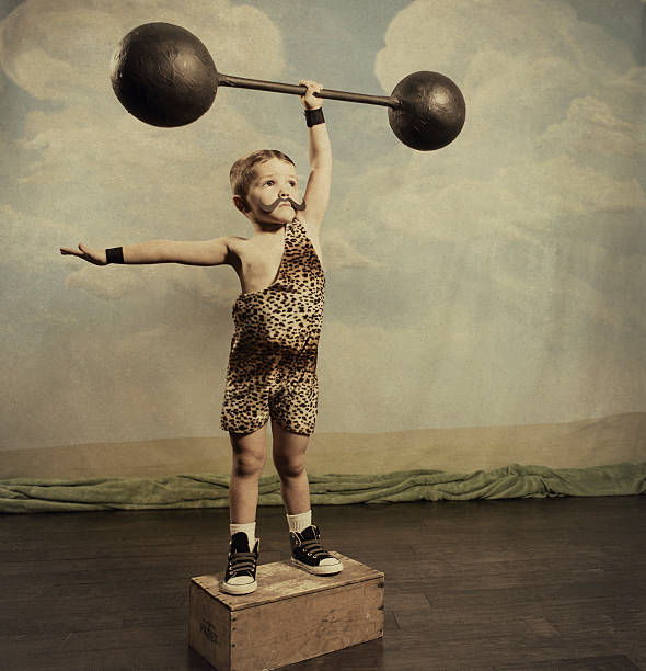 Strongman A young dead lifter has mastered gravity. You never know how far you can go until you try. circus photos stock pictures, royalty-free photos & images