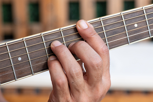 Close up of fingers for guitar chords