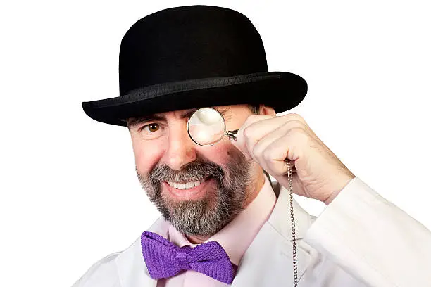 Photo of Happy looking man with a monocle in his hand