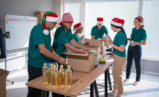 istock Volunteers work at Christmas in community donation center. 1661139372