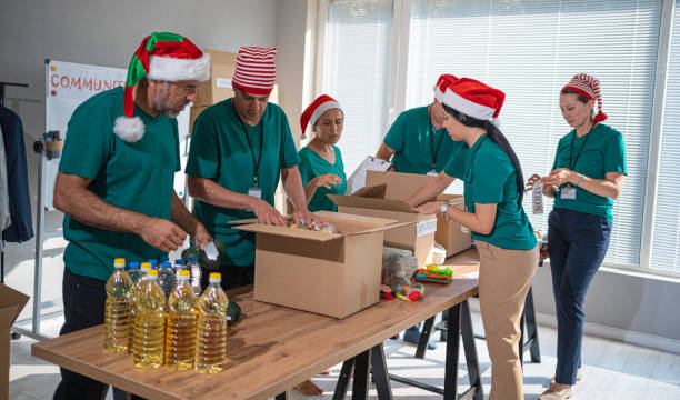 Volunteers work at Christmas in community donation center.
