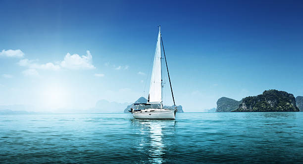yacht and blue water ocean stock photo