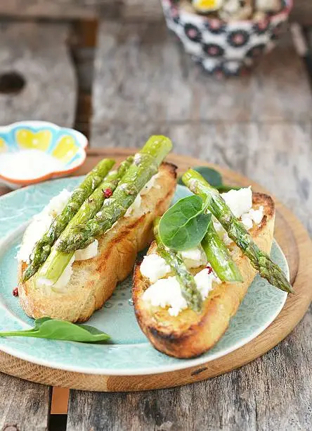 bruschetta with asparagus on the blue plate