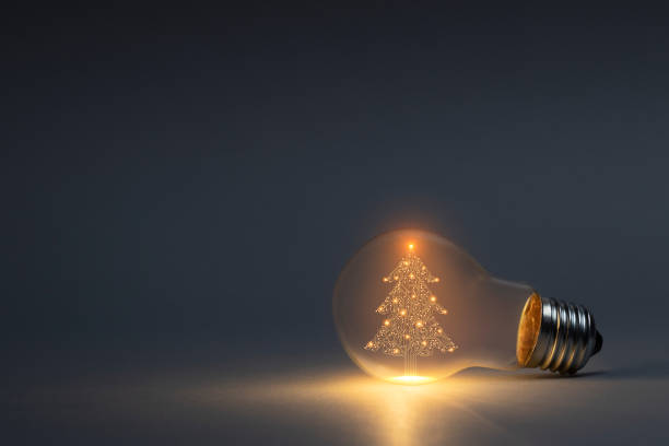 istock Circuit board Christmas tree symbol in light bulb on dark background 1661170193