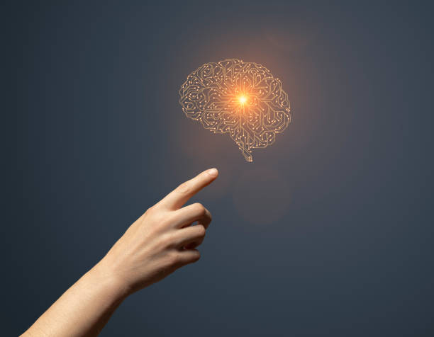 istock Artificial intelligence circuit board brain symbol and hand touching it 1661174165