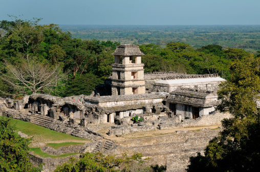 Mexico, The ancient city of Palenque sits like a king on a throne of jungle where plains meet mountains. The picture presents general view of the palace complex