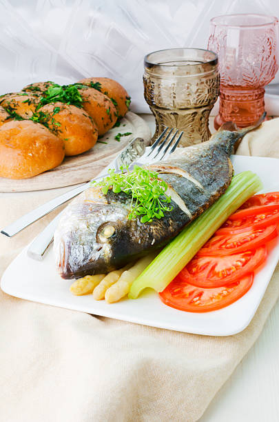 istock Fried Fish (Dorada) With Asparagus, Celery Stalk And Sliced Tomato 166118972