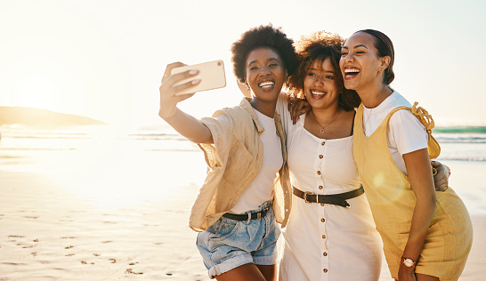 Beach sunset, selfie and group of friends happy, smile and enjoy travel vacation, summer or post photo to social media app. Excited memory picture, photography and gen z women bonding on holiday