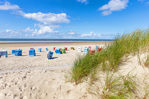 West beach with hooded beach chairs and tents on Borkum island, East Frisia, Lower Saxony, Germany