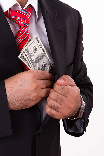 istock Man Putting Money into Pocket 166122944
