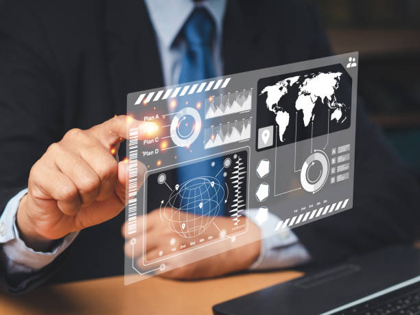 istock Businessman in a suit point at the report on a virtual screen while sitting in the office 1661232797